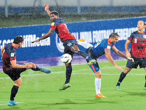 keen tussle: India's Robin&#8200;Singh (second from right) vies for the ball with Guam defenders during their clash at the Sree  Kanteerava Stadium in Bengaluru on Thursday. dh photo/ srikanta sharma r