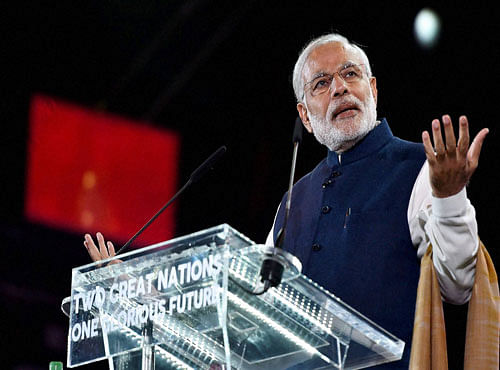 Prime Minister Narendra Modi addresses Indian Community at Wembley Stadium in London on Friday. PTI Photo