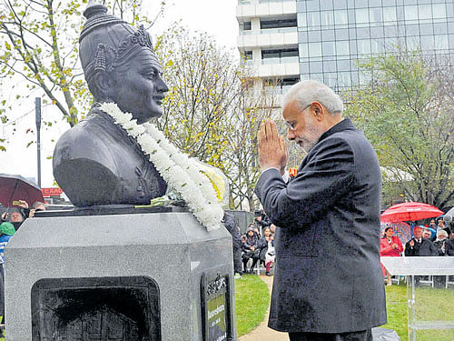 respect: Prime Minister Narendra Modi pays homage to the 12th century philosopher Basaveshwara after unveiling his statue in London on Saturday. pti