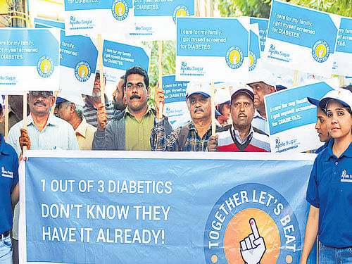 People take part in the walkthon on the occasion of World  Diabetes Day in the City on Saturday. Dh photo