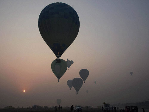 Hot air balloons fly around the Taj Mahal during the international balloon festival 2015 on the banks of the Yamuna river in Agra on Sunday. PTI Photo