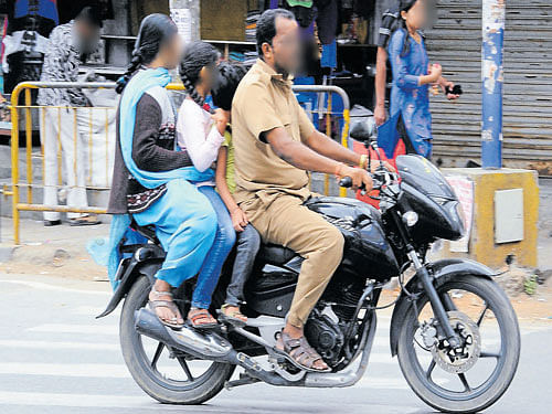 Bike riders without helmet is a common sight.