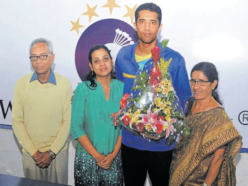 family time: Shuttler Arvind Bhat with his father Prabhakar (extreme left), wife Pallavi (left)  and mother Saraswathi on Thursday. dh photo