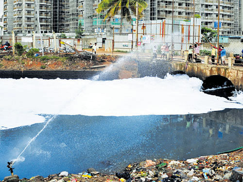 temporary measure A clean water sprayer was installed at the waste weir of Bellandur Lake to contain foaming.  DH PHOTO