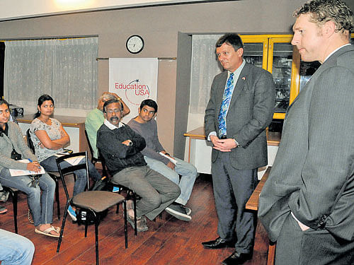 Charles E Luoma-Overstreet, Chief of the Consular Section, US&#8200;Consulate General, Chennai, and Vice Consular Brock D Fox interact with students and parents at the 'Study in the US' event in the City on Thursday. dh photo