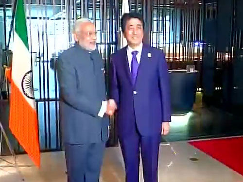 The national flag was in the background of Prime Minister Modi and Abe's customary handshake at the Summit and was hoisted on a stand next to that of Japan. Photo courtesy: Twitter