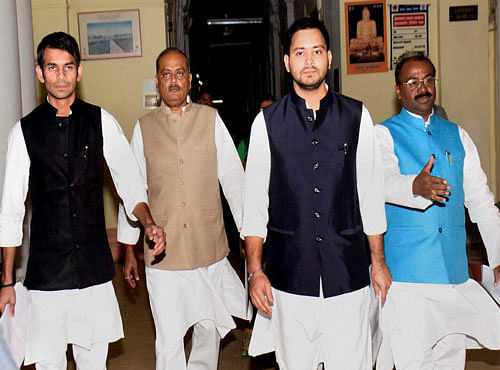 Bihar deputy chief minister Tejashwi Yadav, Health Minister Tej Pratap and other ministers arrive to attend the first cabinet meeting of their government in Patna on Saturday. PTI Photo