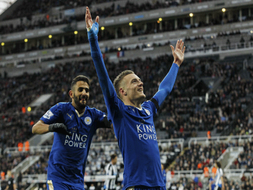 Jamie Vardy celebrates scoring the first goal for Leicester City to equal the record for scoring in consecutive Premier League games . Reuters Photo.