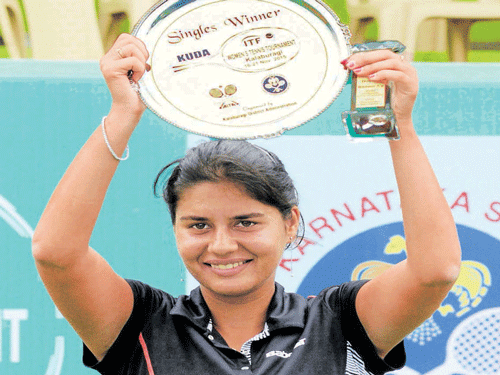 Triumphant: Prerna Bhambri is all smiles after clinching the ITF title in Kalaburagi on Saturday. DH PHOTO Krishna Kumar