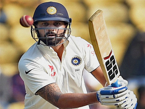 Cricketer Murli Vijay plays a shot during the 3rd test match against South Africa in Nagpur on Wednesday. PTI Photo