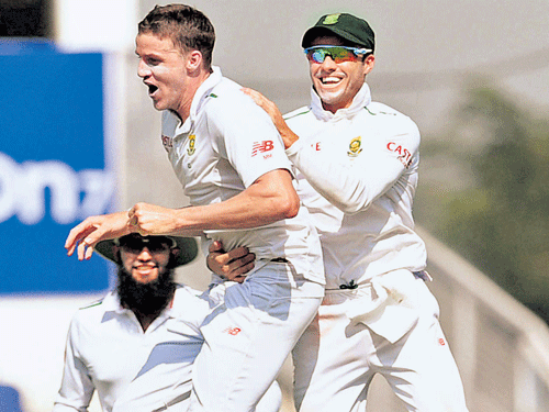 LEAP OF JOY: Morne Morkel (centre) celebrates after claiming the wicket of Virat Kohli on the opening day of the third Test in Nagpur on Wednesday. PTI