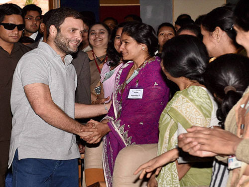 Congress Vice President Rahul Gandhi greet students on his arrival at a interactive session with students of Mount Carmel College in Bengaluru on Wednesday. PTI Photo