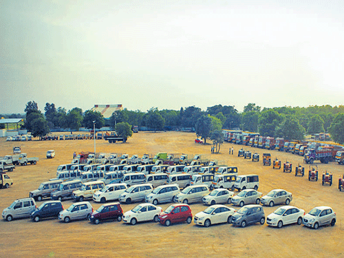 Used cars and tractors await buyers at a Shriram Automall.