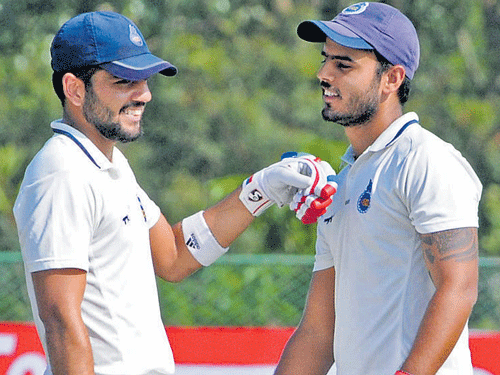 two to tango Dhruv Shorey (left) and Nitish Rana scored patient centuries to help Delhi eke out a gritty draw against Karnataka on Thursday. DH photo/ mr manjunath