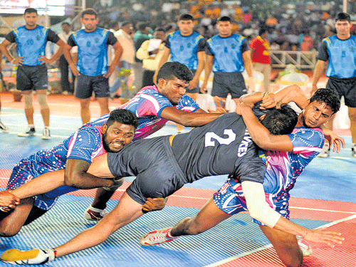 You are out, sir! Tamil Nadu players bring down Services' raider Rohit Kumar during their clash in the National Championships on Thursday. DH Photo Srikanta Sharma R