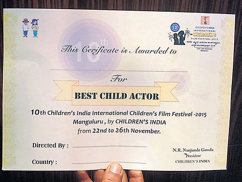 The certificate presented to best child artiste Jagadeesh T&#8200;Bellare (from the movie 'Kanasu') at the valedictory held in Mangaluru on Thursday does not have the name of the child artiste nor the signature of any jury.  DH photo