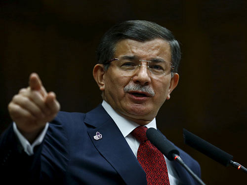 Turkey's Prime Minister Ahmet Davutoglu addresses members of parliament from his ruling AK Party at the Turkish parliament in Ankara. Reuters Photo