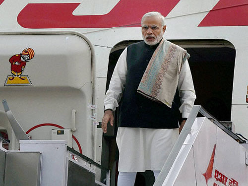 Prime Minister Narendra Modi before his departure for France to attend the Paris Climate Conference, at AFS Palam in New Delhi on Saturday. PTI Photo