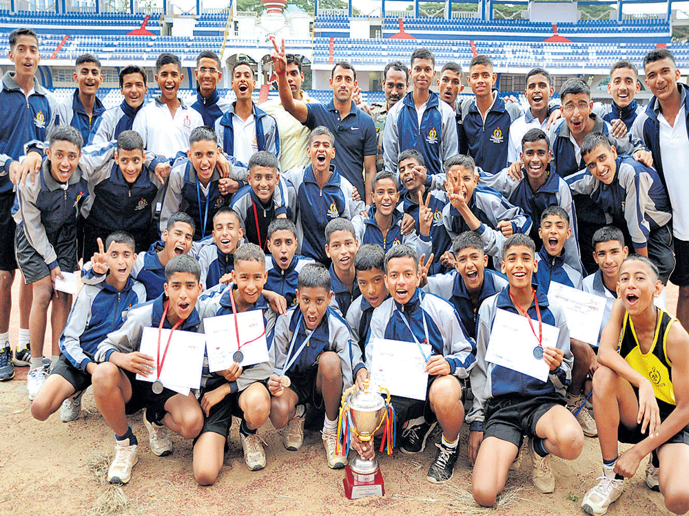 champions: Rashtriya Military School, team winners in the boys section of the Deccan  Athletic Club's Weekend Meet in Bengaluru on Sunday. BELOW: St Francis Xavier High School, winners in the girls section, with chief guest, former international athlete Sunder Raj Shetty and organising secretary Anantharaju. DH Photo.