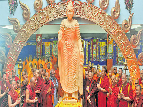 Monks offer prayers to a statue of the Buddha during the Buddhist festival celebrations at the Jnana Jyothi Auditorium in the City on Tuesday. KPN