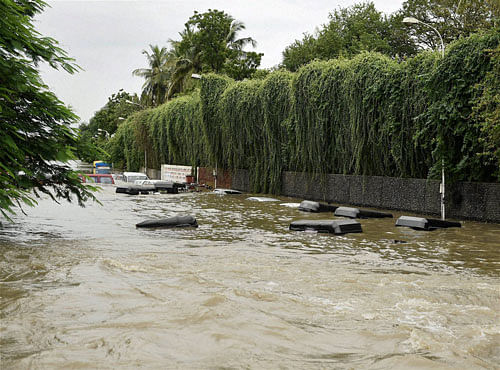 A Water lodged road near Kotturpuram during heavy rains in Chennai on Wednesday. PTI Photo