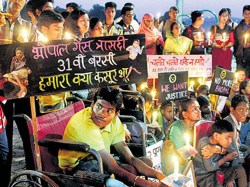 Children of survivors of gas tragedy light candles to pay  tributes to the victims of gas tragedy on the eve of the 31st  anniversary of gas disaster in Bhopal on Tuesday. PTI