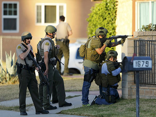 Police officers conduct a manhunt after a shooting rampage in San Bernardino. Reuters Photo