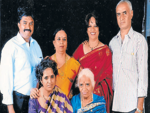 (Sitting, from left) Nirmala (daughter) and Gangu Bai.  (Standing) Sons Suresh and Satya, and daughters Lalitha and Pramila.