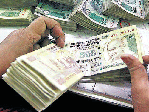 Forex dealers said gains in the dollar against major global currencies and a lower opening in the domestic equity markets, weighed on the rupee. DH file photo