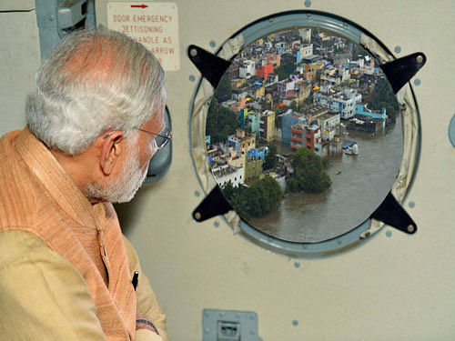 Prime Minister Narendra Modi conducting an aerial survey of rain hit areas of Chennai, Tamil Nadu on Thursday. PTI Photo.