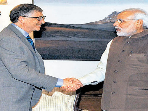 Prime Minister Narendra Modi shakes hands with Bill Gates, Co-Chair and Trustee, Bill and Melinda Gates Foundation, at a meeting in New Delhi on Friday. PTI