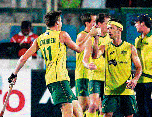 Australia's Eddie Ockenden (left) celebrates the team's semifinal win over the Netherlands with veteran Jamie Dwyer in Raipur on Friday.