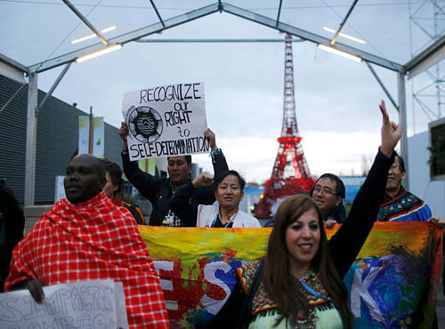 Representative of indigenous peoples stage a demonstration during the World Climate Change Conference 2015 (COP21) at Le Bourget. Reuters photo