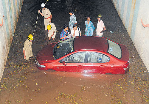 A car caught in a flooded underpass during heavy rain at  K R Circle in Bengaluru. DH&#8200;FILE&#8200;PHOTO