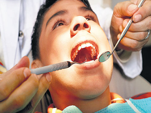 Preventative oral care can reduce the need for unpleasant dental drilling and filling by 30-50 percent, says a study. AP file photo