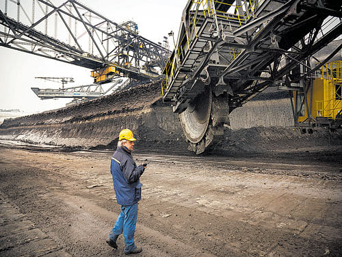 A bucket-wheel excavator at a coal mine. Germany, which reached a milestone last year by reducing its overall energy consumption while still recording modest economic growth of 1.5 per cent, may be a model for global ambitions to rein in fossil fuel use. NYT