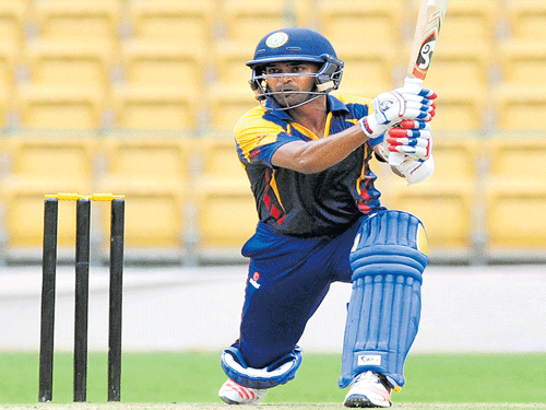 lone ranger: R Vinay Kumar's half-century and a four-wicket haul couldn't stop Railways from emerging winners by one wicket on Thursday. dh photo/ kishor kumar bolar