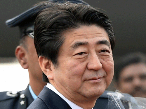 Japan's Prime Minister Shinzo Abe upon his arrival at AFS Palam in New Delhi on Friday. PTI Photo.