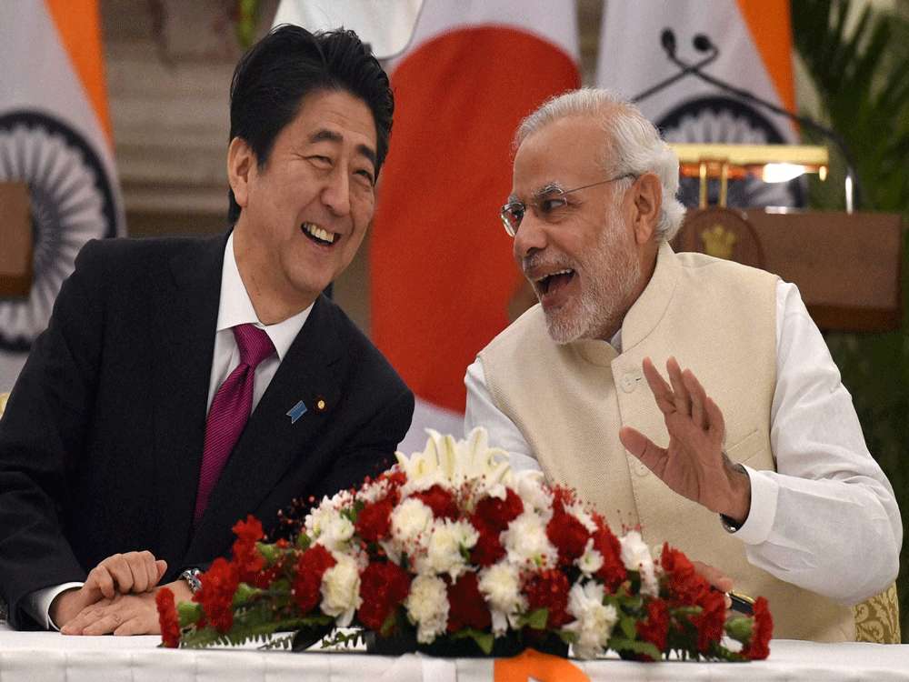 Prime Minister Narendra Modi and his Japanese counterpart Shinzo Abe. PTI Photo.