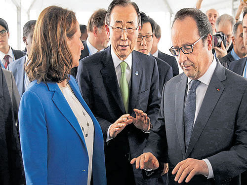 French President Francois Hollande (R), UN Secretary-General Ban Ki-moon (C) and French Ecology Minister Segolene Royal interact at Le Bourget, Paris on Saturday. Reuters