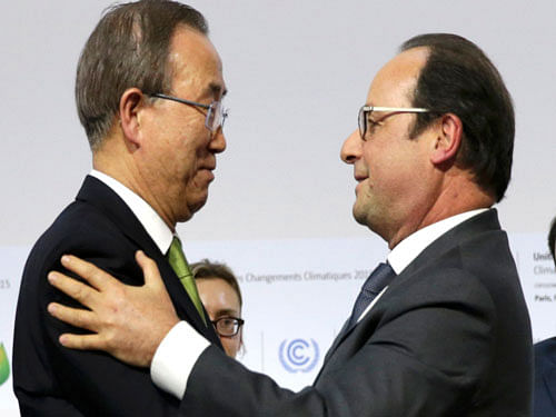French President Francois Hollande and UN Secretary-General Ban Ki-moon embrace during the final plenary session at the World Climate Change Conference 2015 (COP21) at Le Bourget. Reuters