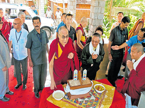 Tibetan spiritual leader the Dalai Lama being accorded  a traditional welcome on his arrival at Bylakuppe Tibetan Settlement in Periyapatna taluk on Sunday. DH photo