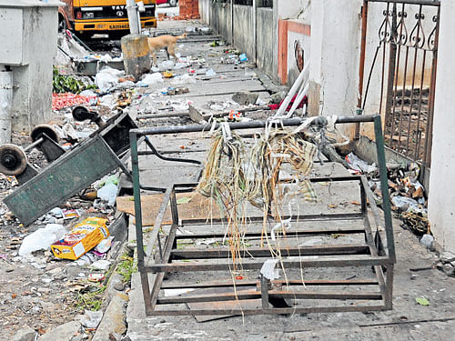 Where to walk? Garbage and debris are seen covering a footpath in Bengaluru. DH file photo