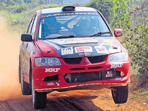 Champions: Lohitt Urs and his co-driver Shrikanth Gowda in action enroute their title at the Coffee Day Rally in Chikkamagaluru on Sunday.