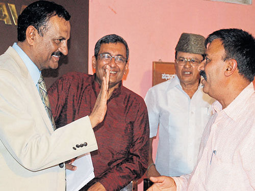 Candidates for the election to legislative council from Kodagu local authority constituency chat at the Kodagu Press Club in Madikeri on Monday. DH&#8200;photo