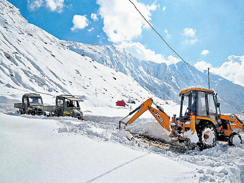 Snow being cleared from Kedarnath Valley in Rudraprayag, Uttarakhand, on Monday, a day after an avalanche. PTI