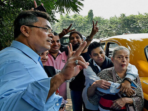 Relatives and friends of Park Street gang rape victim Suzatte Jordan express happiness after a court found the three accused guilty in the case, in Kolkata on Thursday. PTI Photo