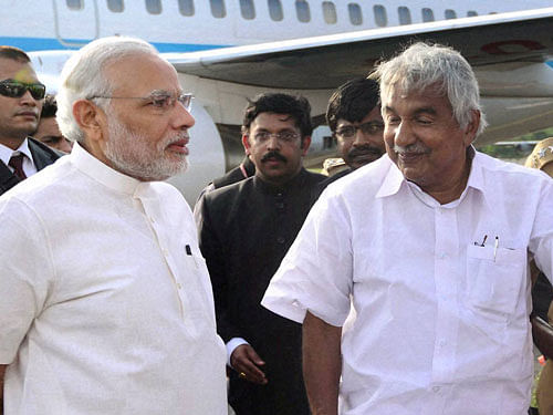 PM Narendra Modi and Chief Minister of Kerala, Oommen Chandy. PTI file phtoo