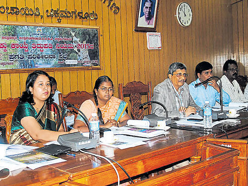 Deputy Commissioner S P Shadakshari Swamy speaks at  the district-level review meeting of Forest Rights implementation at the Zilla Panchayat Hall in Chikkamagaluru  on Tuesday. DH photo