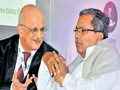 Nasscom President R Chandrasekhar (left) in conversation with Karnataka CM Siddaramaiah in Bengaluru. DH PhoTo